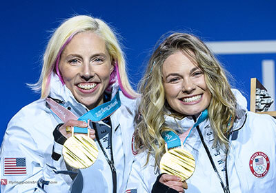 Kikkan Randall and Jesse Diggins with gold medals.